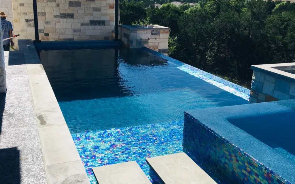 Hill Country residential swimming pool and spa, provided by Tejas Hills